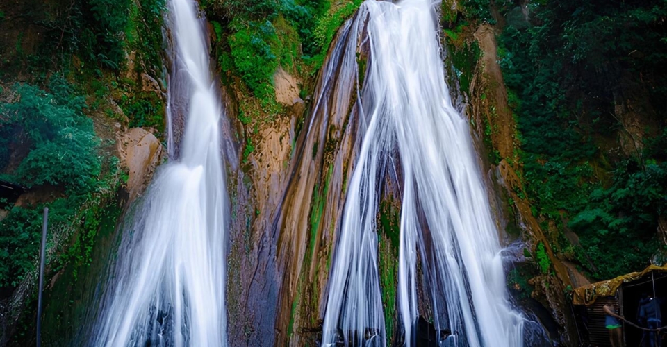 majestic-waterfall-cascades-down-mosscovered-rocks-600nw-2472273543